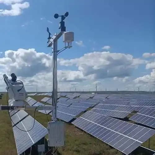 Utility-scale solar power plant with an integrated meteorological monitoring station measuring irradiance and module microclimates.